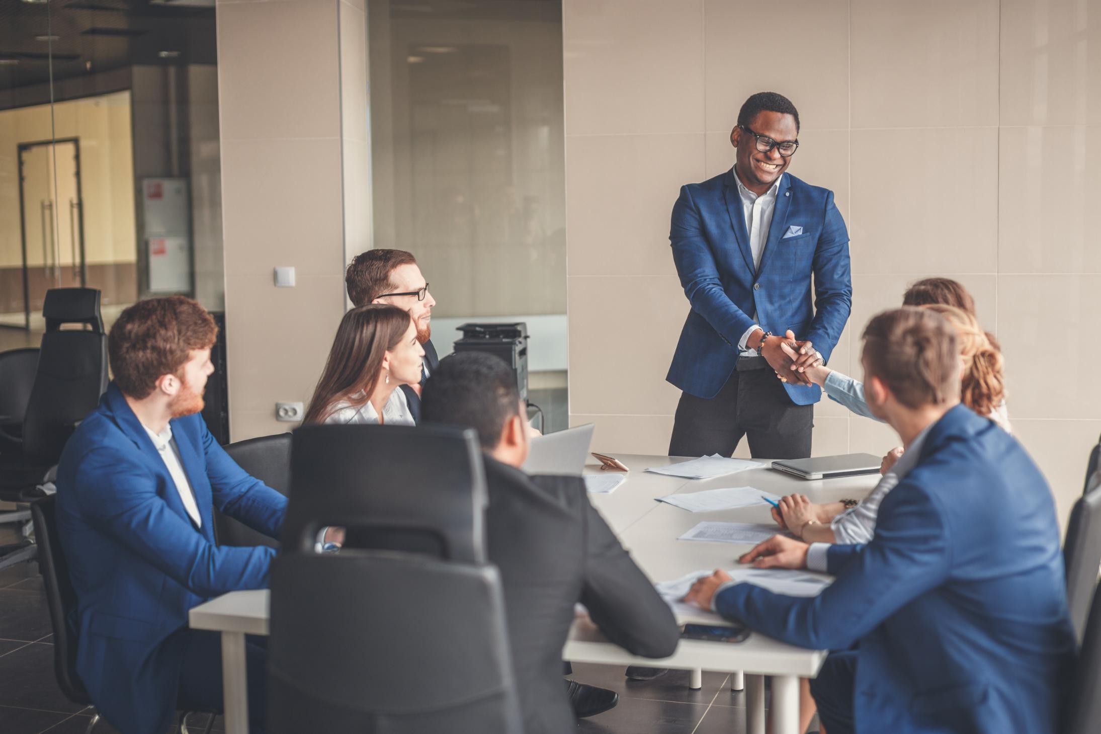 Executive briefing meeting at a small conference table