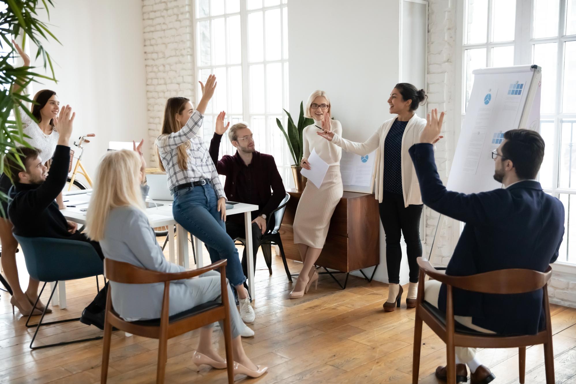 Employees asking questions at an executive briefing training session