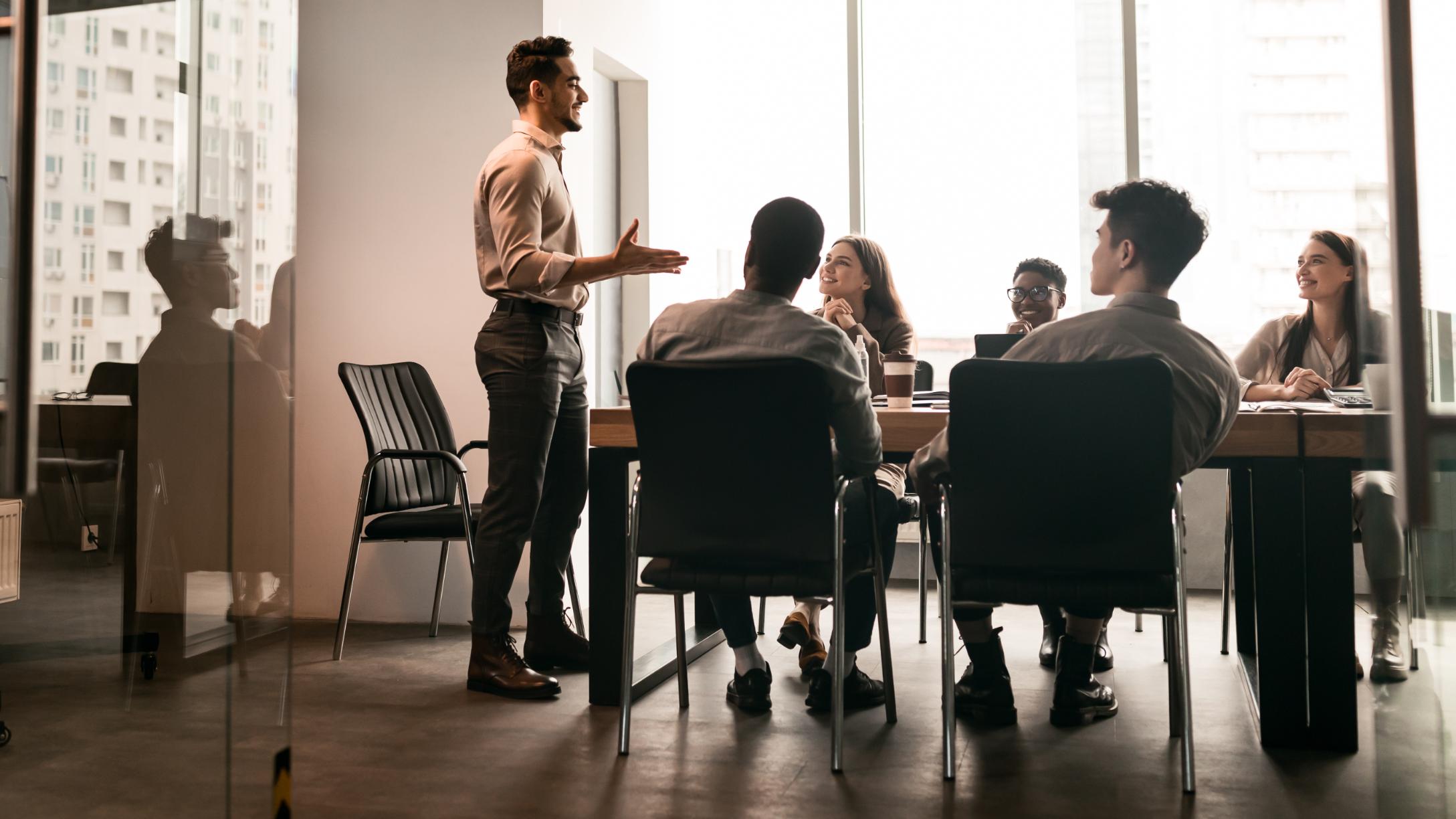 Colleagues having meeting in executive briefing center